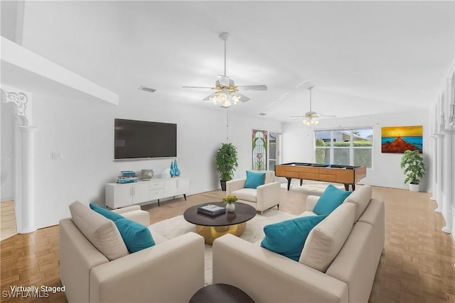 living room featuring light parquet flooring and lofted ceiling