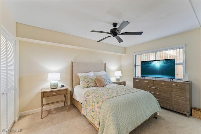 bedroom with light colored carpet and ceiling fan