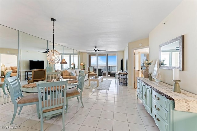 dining room featuring light tile patterned floors and ceiling fan