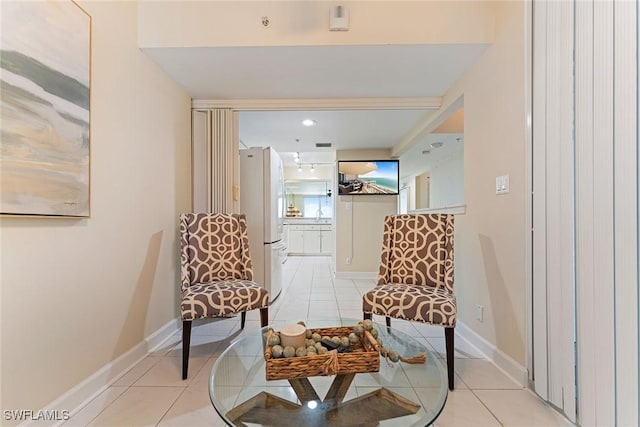 sitting room with light tile patterned floors