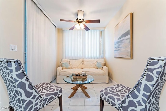 tiled living room with ceiling fan