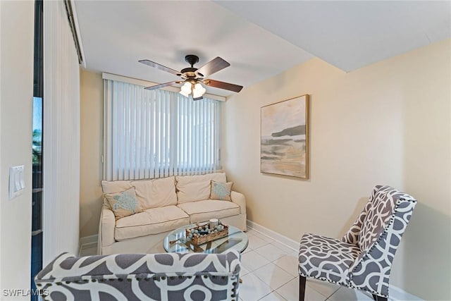 tiled living room with ceiling fan