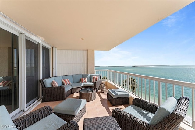 balcony featuring a water view and an outdoor hangout area