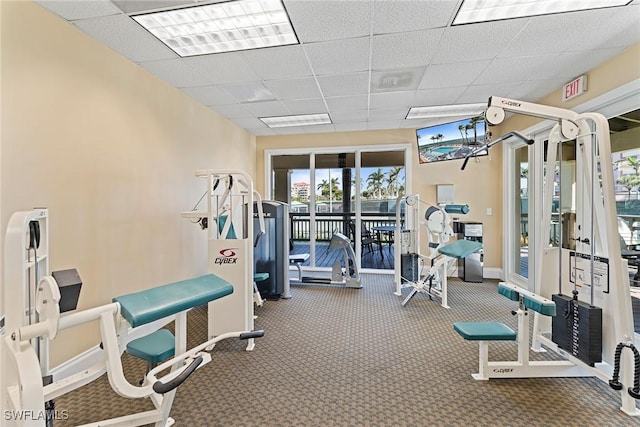 exercise room with a drop ceiling