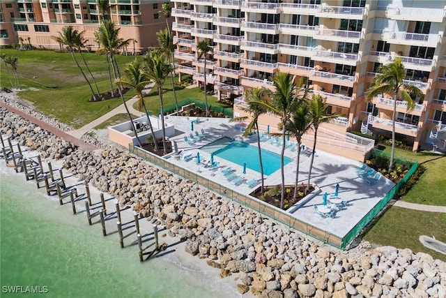 view of swimming pool with a water view