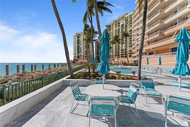 view of patio with a water view