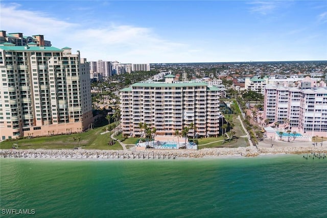 bird's eye view featuring a water view and a beach view