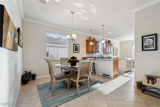 dining area featuring visible vents, crown molding, baseboards, a chandelier, and light tile patterned flooring