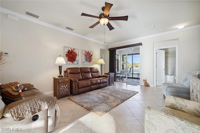 living room with light tile patterned floors, visible vents, ceiling fan, and ornamental molding