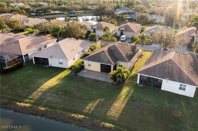 aerial view with a residential view and a water view