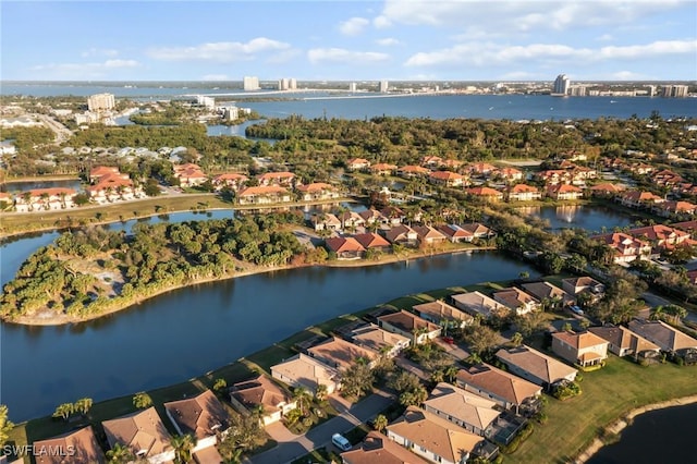 birds eye view of property with a residential view and a water view