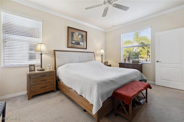 bedroom with light colored carpet, a ceiling fan, baseboards, and ornamental molding