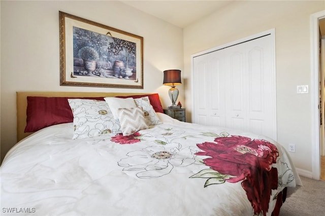 bedroom with a closet and carpet floors