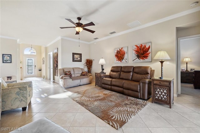 living room with visible vents, baseboards, ceiling fan, ornamental molding, and light tile patterned floors