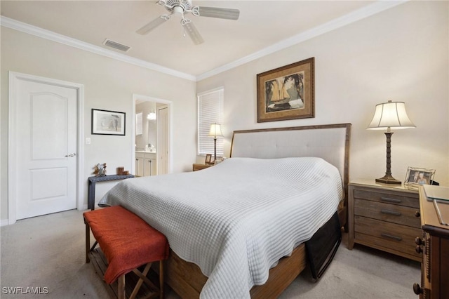 bedroom with ensuite bath, crown molding, light colored carpet, and visible vents