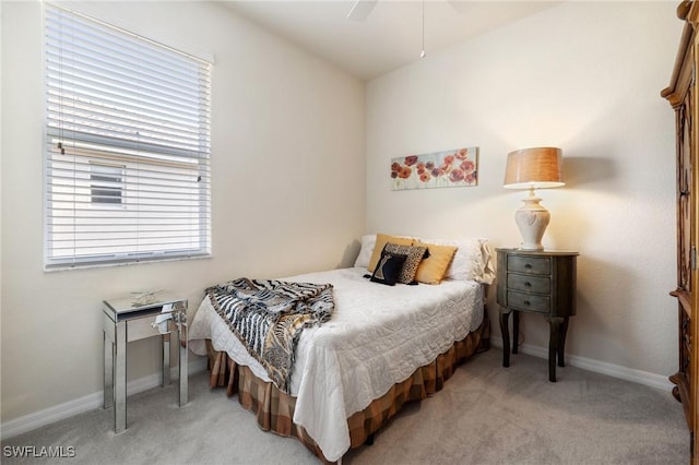 bedroom with baseboards, light carpet, and a ceiling fan