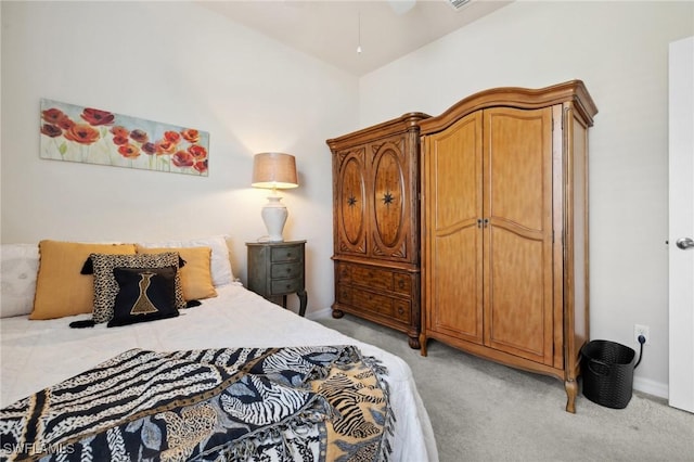 carpeted bedroom featuring baseboards