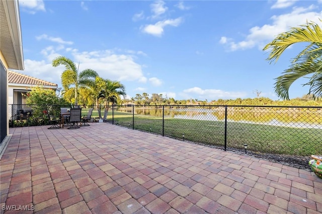 view of patio with outdoor dining space and fence