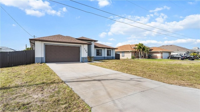 ranch-style house featuring a garage and a front yard