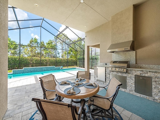 view of patio / terrace featuring a grill, a lanai, and exterior kitchen