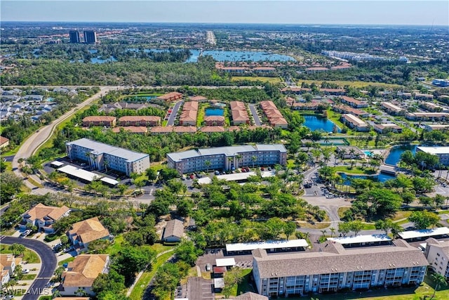 drone / aerial view with a residential view and a water view