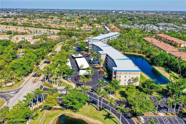 birds eye view of property with a water view and a residential view