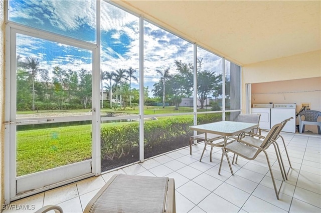 sunroom featuring washer and clothes dryer