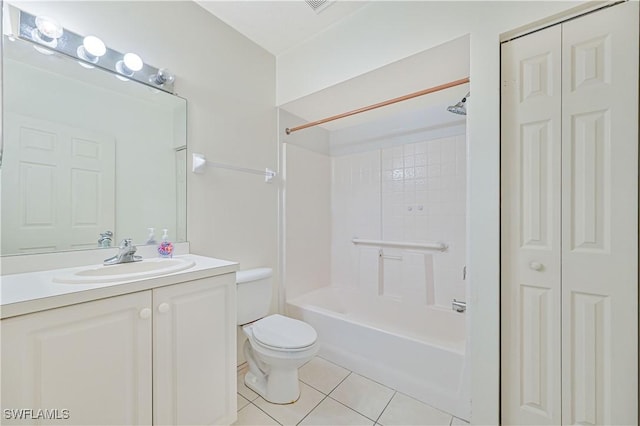 bathroom with tile patterned floors, toilet, a closet, washtub / shower combination, and vanity