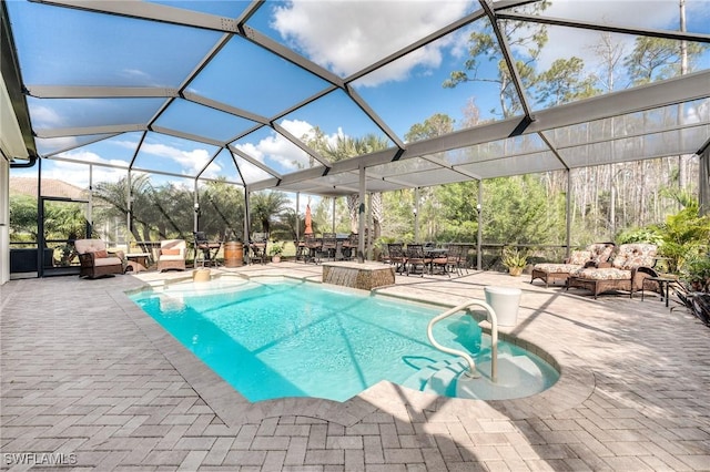 view of swimming pool featuring a patio, pool water feature, and glass enclosure