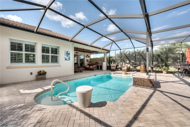 view of pool featuring a patio, a lanai, and pool water feature