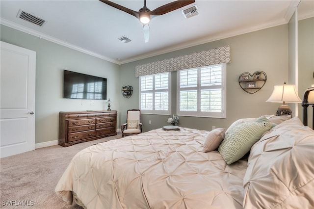 bedroom featuring crown molding, ceiling fan, and light carpet