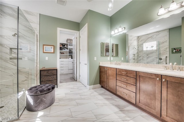 bathroom featuring vanity and a tile shower