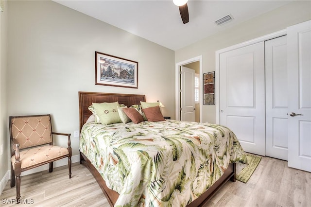 bedroom featuring light hardwood / wood-style flooring, a closet, and ceiling fan