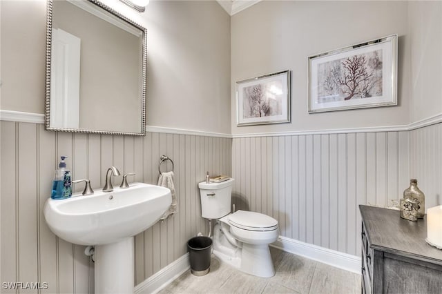 bathroom featuring hardwood / wood-style flooring, sink, and toilet