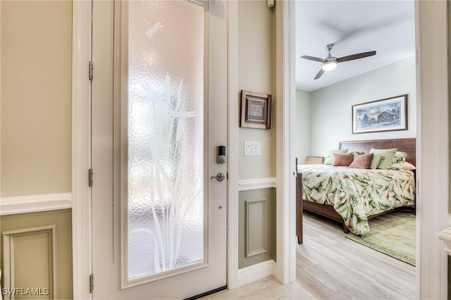 bedroom with ceiling fan and light wood-type flooring