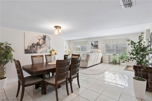 dining room featuring light tile patterned flooring