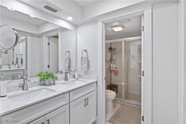 bathroom with vanity, toilet, and an enclosed shower