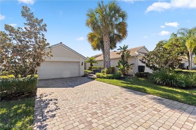 view of front of house featuring a garage and a front yard