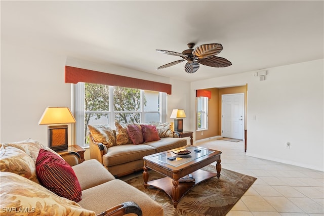 tiled living room with ceiling fan