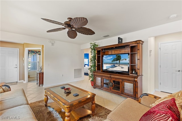 living room featuring light tile patterned floors and ceiling fan