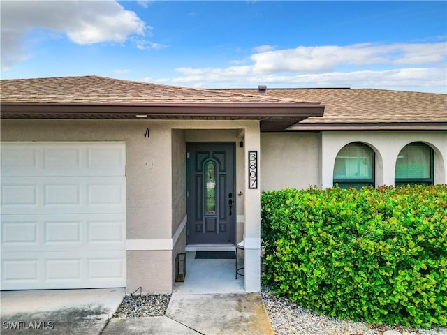 doorway to property featuring a garage