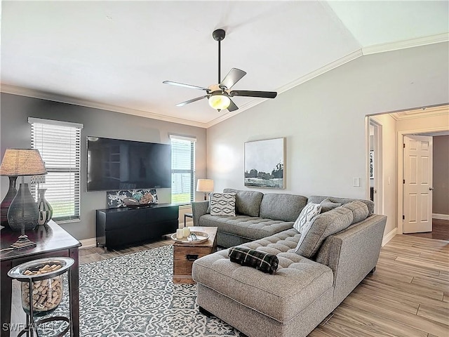 living room featuring ceiling fan, ornamental molding, vaulted ceiling, and light wood-type flooring