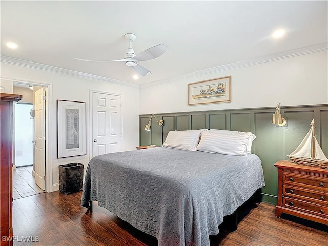 bedroom with crown molding, dark hardwood / wood-style floors, and ceiling fan