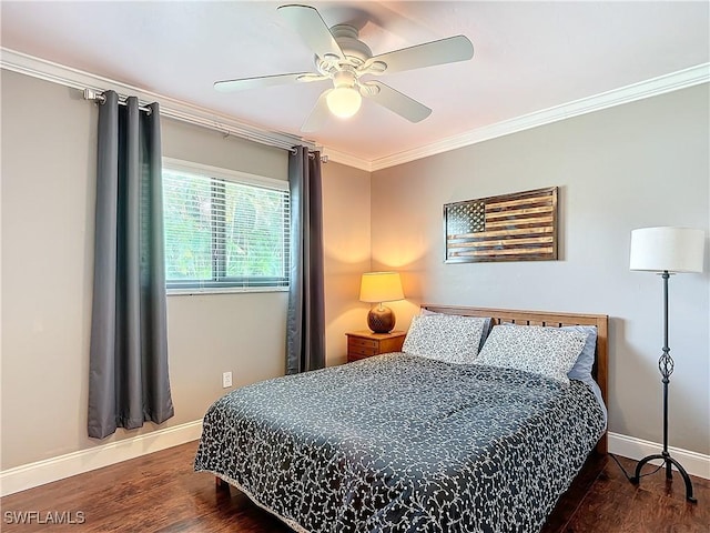 bedroom featuring crown molding, dark hardwood / wood-style floors, and ceiling fan