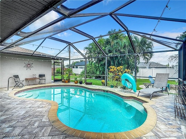 view of pool featuring a patio and a lanai