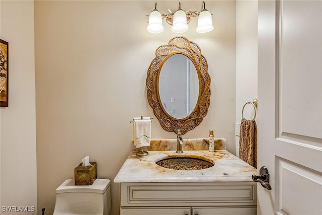 bathroom with vanity and toilet