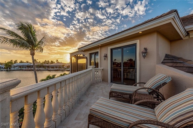 balcony at dusk with a water view