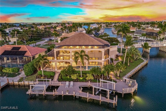 aerial view at dusk with a water view