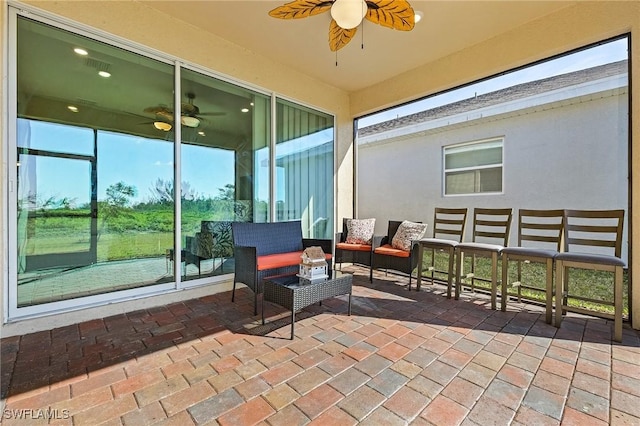 view of patio / terrace featuring an outdoor living space and ceiling fan