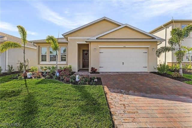 single story home with a garage and a front lawn